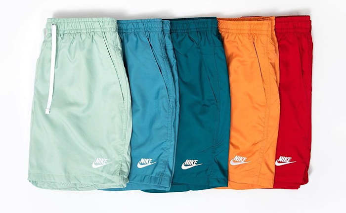 View of green, blue, orange, and red Nike shorts.